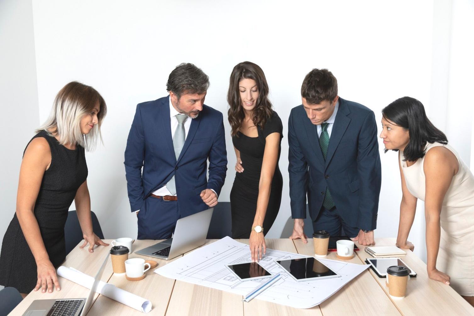Person organizing financial documents with modern budgeting tools